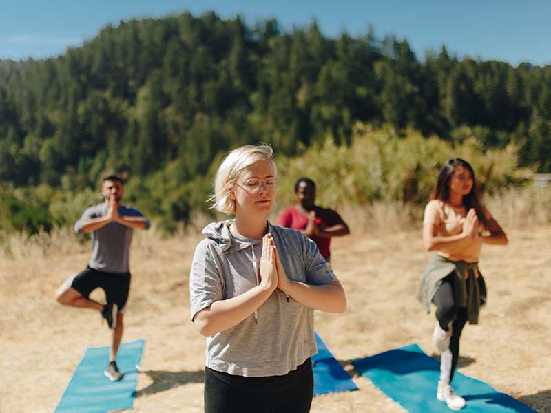 Individuals doing Yoga